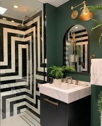 Monochrome tiles paired with beautiful dark green walls = a match made in heaven. #BlackTiles #WhiteTiles #PatternedTiles #PatternedWallTiles #BathroomTiles #BathroomWallTiles #TileInspo #Tiles #TileDesign #TileLove #HomeDecor #TileLovers #InteriorDecor #InteriorDesign #WallTiles #FloorTiles