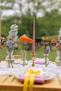 Weddings At Woodfords Max Turner Weddings Wooden Table Colourful Wildflowers Flower Bottles Tall Candles Gold Decor #wedding #weddingtable #weddingdecor