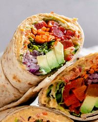 Elevate your lunch game with this easy-to-make hummus wrap delight. Packed with fresh veggies, creamy hummus, and a hint of zesty flavor, it's the perfect quick meal for busy days. Whether you're meal prepping for the week or need a satisfying snack on the go, this wrap is sure to please. Enjoy a burst of taste and nutrition in every bite!