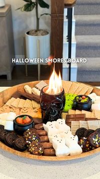 Kristin Miller | Creator | Dallas, TX on Instagram: "Halloween smores board💀Comment “fun” to get everything sent directly to your DMs! This skull fire pit is a must have this spooky season! This would be great to bring to a halloween party or have for a date night at home. Save & share with someone you want to make this with🎃 • WHAT YOU NEED: • large board or tray • mini tabletop firepit • marshmallows • assorted chocolates and candies • graham crackers and cookies • skewers • • #halloweenideas #halloweensmores #smores #halloweendesserts #easydessert #partyideas #halloweenparty #foodboard #halloweenrecipes"