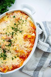 Layers of beef ravioli, marinara, and a decadent mixture of cheeses make this baked ravioli the BEST EVER!