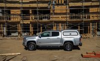 This Century commercial mid-rise cap is reinforced for commercial roof racks, offers optional fiberglass side doors, toolbox options and more. | Campway's Truck Accessory World