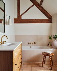 The color palette of this bathroom, designed by Field Day Studio, was inspired by the pink tones of a gentle sunrise, creating a warm, open and inviting space.  . Photography by Dean Hearne