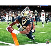 This original photograph captures Michael Thomas in action. It is officially licensed by the National Football League.