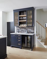 Transitional Kitchen Coffee Bar with Natural Stone Backsplash  If you have enough space in your kitchen, adding a coffee bar will enhance your design by maximizing functionality.