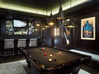 Sleek black on black pool table.