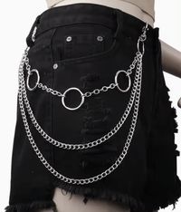 Add some edgy fun to any of your pants with this chain accent piece. This style features 3 levels of chains connected to o-rings...1 with large rings and 2 longer ones with standard curb chains. Made of zinc alloy.