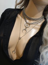 This handmade chunky stainless steel chain layered necklace set is a stunning piece of jewelry that is perfect for those who love bold and edgy accessories. The necklace features two necklaces, one thick chunky cover in an adjustable length, and a 4-strand drop festoon design, adding depth and dimension to the piece with a shiny Fang or cat's claw pendant.  The chunky chain is made of sturdy stainless steel, ensuring its durability and longevity.  This necklace set is an excellent handmade gift for someone special. It is a perfect choice for those who love alternative and goth styles, as well as anyone who wants to make a statement with their jewelry. It runs from 15 to 18 inches in length with a built-in extender. The necklace is waterproof and sweatproof and will never tarnish or fade! 2