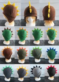 These dinosaur hats are made of fleece. ⫸ Perfect for: fans, cold weather, costumes, or conventions. Very warm!  ⫸ Size: Fits anyone age 5+, one size fits most. Circumference about 24-25 in. ⫸ Care instructions: I recommend hand wash but should be fine in machine wash cold. All hats are made in a smoke-free, pet-free environment. All hats are made with a sewing machine and patterns and designs drawn, cut, and made by me.