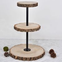 PRICES MAY VARY. Quantity: 1 Cake Stand + 1 Bag Of Tools Material: Wood | Metal Wood Color: Natural Metal Pole Color: Black Style: 3 Tier Wooden Cupcake Stand w/ Metal Poles Overall Size: 19.5"H x 13.5" Dia. Small Wooden Plate Size: 7.5" Dia. Medium Wooden Plate Size: 9" Dia. Large Wooden Plate Size: 13.5" Dia. Wooden Plate Thickness: 1" Metal Pole Size: 17"L x 3" Dia. Bag Of Tools Includes: 5 Nails (4x Flat, 1x Sharp-- Only 1 is needed to secure the middle plate) 1 Screw Driver Assembly Require