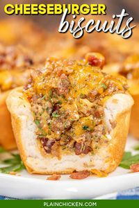 Bacon Cheeseburger Biscuits Recipe—This easy 30-minute dinner recipe is sure to be a hit with the whole family! Ground beef, bacon, Worcestershire, hamburger seasoning, Velveeta, and cheddar cheese are stuffed into buttermilk biscuits and baked in a muffin tin. Serve as a main course or a party appetizer.