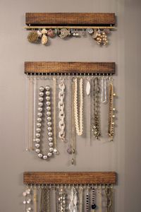 Set of three wood and brass display racks: two for necklaces and bracelets, one for earrings (wall hanging)