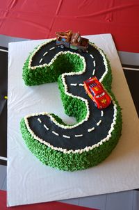 Cake for Disney Pixar Cars/Lightning McQueen third birthday party. Made with two Bundt cakes cut to shape the number 3.