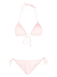 Susan halterneck bikini set from REINA OLGA featuring blush pink, recycled polyamide blend, stretch-design, triangle cup, halterneck tie fastening, rear tie fastening, classic bottoms, mid-rise and side-tie bottoms. Be mindful to try on swimwear over your own garments.. This item is made from at least 50% recycled or upcycled materials. For recycled synthetic clothing products, we highly recommend using a microfibre-catching washing bag to ensure that no microplastics that can pollute water are