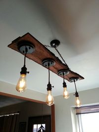 Light fixture I made over Labor Day weekend,  from reclaimed pallet pieces with live edge, cloth corded old style sockets,  and Edison bulbs.