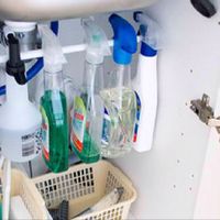 A tension rod (like a simple shower rod!) in a cabinet to create vertical space storage - great idea!