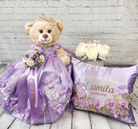 Packages: Complete package includes: 🧸 Quinceanera Bear or Doll (Includes bear or doll, Dress, Petticoat, Jewelry, Metal Tiara, Bouquet, Doll stand, Personalized ribbon) 👸🏻 Tiara upgrade for Bear/Doll  🧸 Doll stand for the Bear/Doll  ️ Kneeling Pillow  👸 Tiara Pillow 📖 Guest Book 🖋️ Pen 📕Bible 🕯️Candle 📷Photo Album 💵Card/Money Box (Acrylic also available for additional cost) 🥂🍾Small Brindis Champagne Set (2 glasses & 1 bottle) 🍰Cake Serving Set ✍🏻 Personalization on items ✍🏻 Ribbon Personalization for Bear  Complete package PLUS includes:  ☝️everything above PLUS Large Brindis champagne set instead of small (16 glasses & 1 bottle)  💐Bouquet **Please indicate metal color (gold, silver or Rosegold), fabric, ribbon and tule colors, etc. **Date of the quinceanera * Name and da