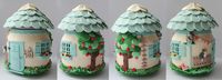 Adorable polymer clay house on a jar