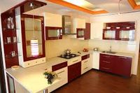 2-Interior. The interior of an Indian style home has basic neutral colors with a pop of color. This kitchen would be a more modernized Indian kitchen. You can see the basic white with red accent.