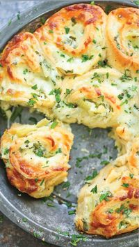 Cheesy Spinach and Artichoke Pinwheels - Everyone’s favorite #spinach and #artichoke #dip in these #cheesy, #creamy #BAKED roll ups!!! So good for #GAMEDAY!!! #artichokehearts #babyspinach #sourcream #mayonnaise #garlicpowder #onionpowder #koshersalt #mozzarellacheese #Parmesan #crescentrolls #egg #parsley #mayo #garlic #onions #mozzarella #cheese #Parmesancheese