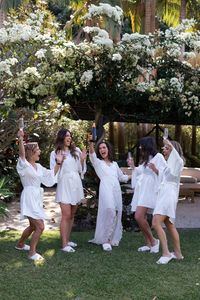 Bride & Bridesmaids the morning of at Sunrise House in the garden.