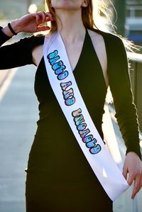 Dazed and Engaged white satin sashes with tie dye lettering for the bride to be. Perfect for a dazed & confused or 90's theme bachelorette party or bridal shower. Brides maid sashes in black with wording boozed and confused available as well. Please message our shop with questions or special requests.