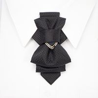 "This tie is our absolute bestseller tie! A black wedding tie with a unique design is a high-quality, hand-made accessory that is suitable for both men and women. It combines traditional elements found on both ties and bow ties to create a modern and versatile look that is perfect for weddings and other formal occasions. The tie is made from premium materials, ensuring that it is durable and long-lasting. The black color gives it a classic and timeless appeal, while the unique design adds a touc