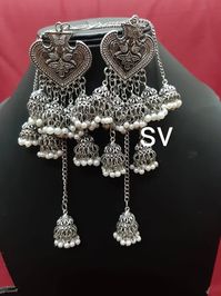 Listed as a must-have earring, jhumkis will always be a woman's favorite accessory! Our Leaf Silver Oxidised Jhumkis dangling with many mini jhumkis along are one you would opt for when you want the simple yet trendy look, pair these up with your straight kurtas or your soft mulmul sarees, these will leave you feeling pretty all day long!