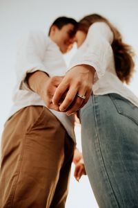 Showing off the ring in a engagement session.  Easy creative pose idea.