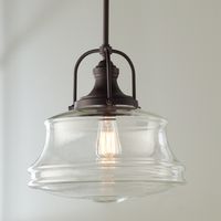 This pendant puts a new spin on schoolhouse style. Curvy clear glass shades are paired with smart details, creating a look that is great for any space.