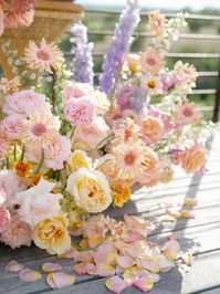 Blush, Lavender and Pale Yellow Flower Arrangements at Ceremony Altar