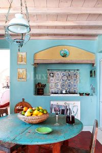 All my colors and the natural wood to boot!  Not at all what I want my end product to look like, but finally an inspiration that matches my Rustic Chic meets Moroccan style! Traditional Mediterranean light blue kitchen, Fiore Arduino, Mykonos