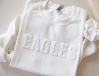 Custom Team Name Sweatshirt, Mascot Sweatshirt, Puff Print, Embossed Print, Gift for Mom, Christmas Gift Idea, School Spirit Sweatshirt The font shown in the main listing image is the font that will be used if you purchase this listing. YOUTH Available via the link below: https://www.etsy.com/listing/1762827919/youth-custom-team-name-sweatshirt-mascot T-SHIRT Available via the link below: https://www.etsy.com/listing/1763466061/custom-team-name-tshirt-mascot-t-shirt The main listing image (EAGLE