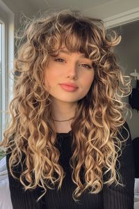 Curly haircuts are all about celebrating your texture and finding a style that complements your face shape. Whether you have loose waves, bouncy spirals, or tight coils, there’s a curly haircut out there that will