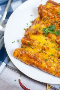 These Air Fryer Enchiladas are packed with seasoned Carne beef tacos baked with melted cheddar cheese and red enchilada sauce.