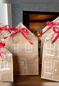 Easy gingerbread house gift bags made with brown paper lunch sacks