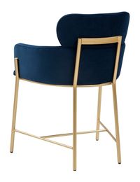 Bring living room comfort to the dining room table with this Charlize Dining Chair. A new contemporary icon, Charlize takes inspiration from the classic club chair for unparalleled luxury, its wraparound silhouette absolutely divine in plush velvet. An open gold frame gives a touch of penthouse glamour.