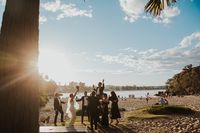 The bridal party dancing on Shelly Beach before heading to the reception. Photo by Good Thanks Media.