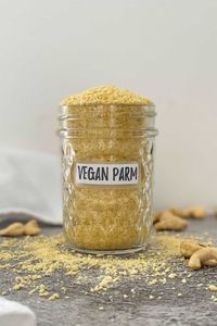 How to make vegan parmesan cheese with just a handful of ingredients! This recipe is so easy and versatile with nut free options, with and without nutritional yeast, and is truly the best DIY homemade parmesan cheese guide. Use sunflower seeds, cashews, almonds and more! #vegan #plantbased #homemade