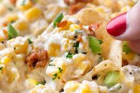 Cheesy and creamy with a spicy kick, this slow cooker corn dip is the ultimate party appetizer. Easy to adjust the heat level, it's great for everyone!