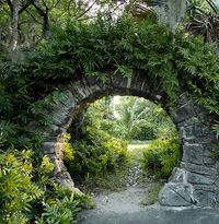 Mortar and stone, vine covered passage opening - perfect for the garden, for my "someday" list. :)