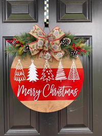 "The Merry Christmas door hanger is perfect statement for your front door, or even an inside door or wall. Tis the season for all things merry & bright! This fun Christmas tree design with greenery will add a pop of color to your Christmas decor. WHAT IS A DOOR HANGER?  Door hangers are all the rage now!  They usually made from 1/4\" plywood, and are painted in so many different styles.  They can be realistic, whimsical, funny, and more. Join your friends and neighbors or be the first to purchas