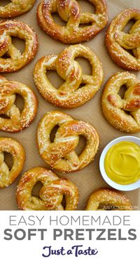 This Easy Homemade Soft Pretzels recipe yields pillowy soft pretzels with a chewy bite and golden brown color. This simple dough can be shaped into all types of pretzels, from twists to bites to nuggets! #softpretzels #softpretzelrecipe #pretzelrecipe #justatasterecipes