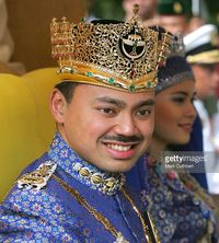 The Crown Prince Abdul Muntaqim Of Brunei, wearing diamond, ruby, emerald and gold crown, & Princess Dayangku Sarah Binti Pengiran Salleh Ab Rahaman in 2004.