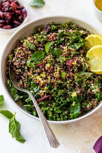 This healthy Quinoa Salad with Kale, Cranberries and Mint is perfect for bringing to a potluck or serving with anything you’re grilling, like chicken , fish, or steaks. #quinoa #quinoasalad #kalesalad #healthyrecipes #vegan #vegetarian #salad #lowcalorierecipes #healthyrecipe