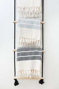 DIY hanging rope ladder as a towel rack