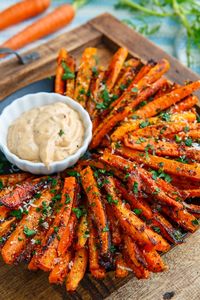 A recipe for Parmesan Roasted Carrot Fries : Sweet roasted carrot fries covered with crispy parmesan cheese!