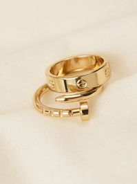 This is such a cute and unique ring set featuring a wrapped nail and simple gold band ring! These simple yet stand out rings are perfect to layer with for a trendy stacked look!