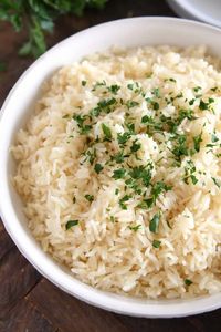 Garlic butter rice is the perfect side dish! It is incredibly flavorful and has the liquid to rice ratio just right for the best fluffy rice. | melskitchencafe.com