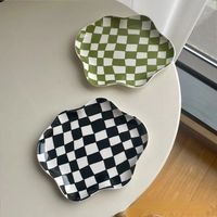 Checkerboard Ceramic Trays make a perfect side table tray. Material: CeramicDimensions: 9" x 6.5"